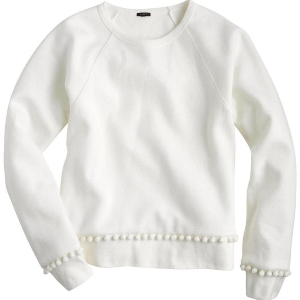 white crew neck with pom poms